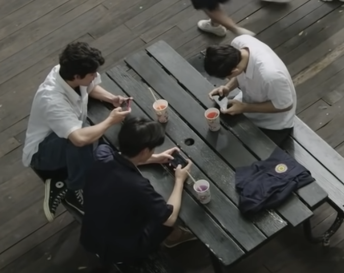 File:Engboys Playing Mobile Games.png